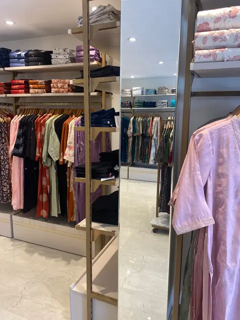 Vismay Chennai: garment rails, open shelving and a full-height mirror